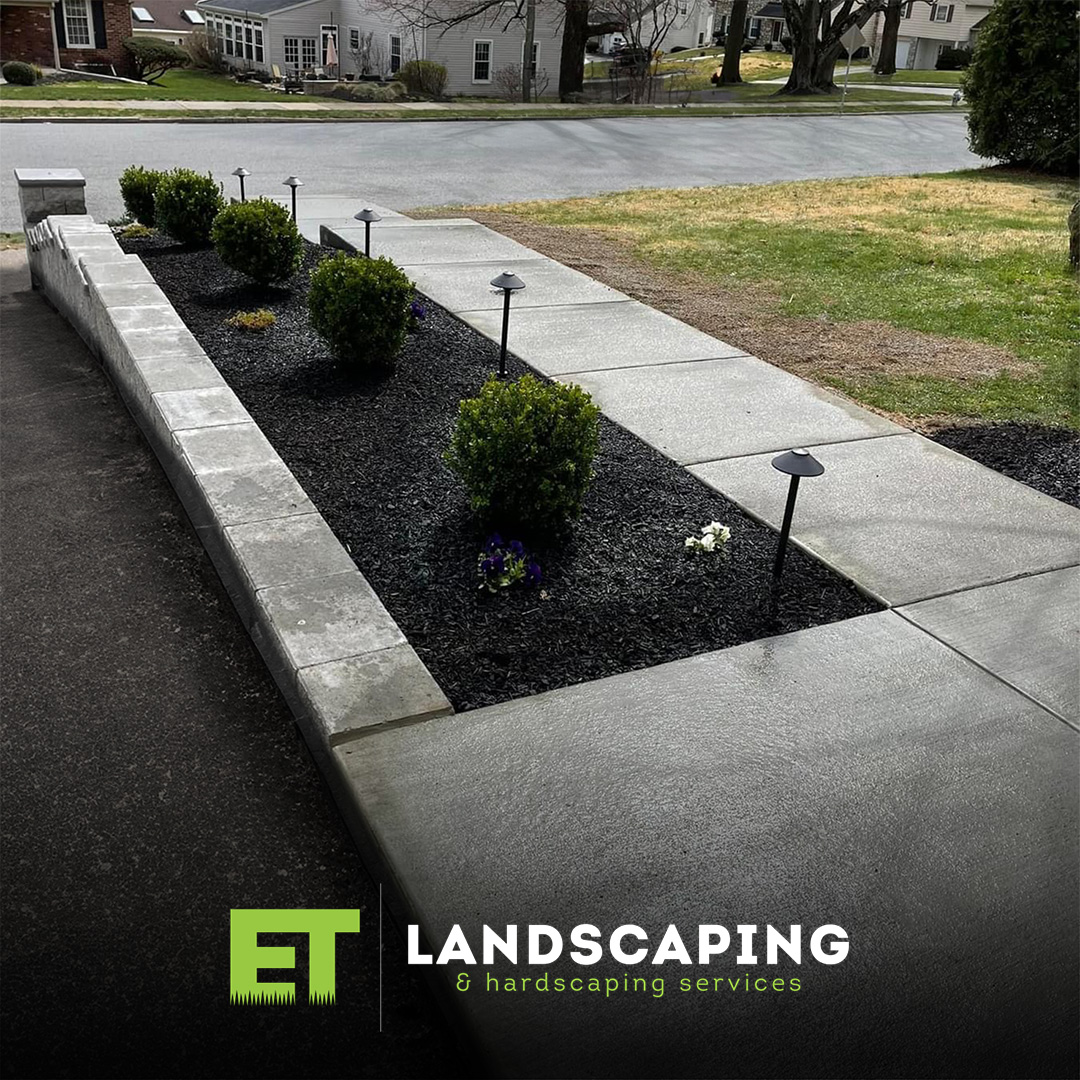 ET Landscaping Project - landscaped-concrete-walkway-black-mulch