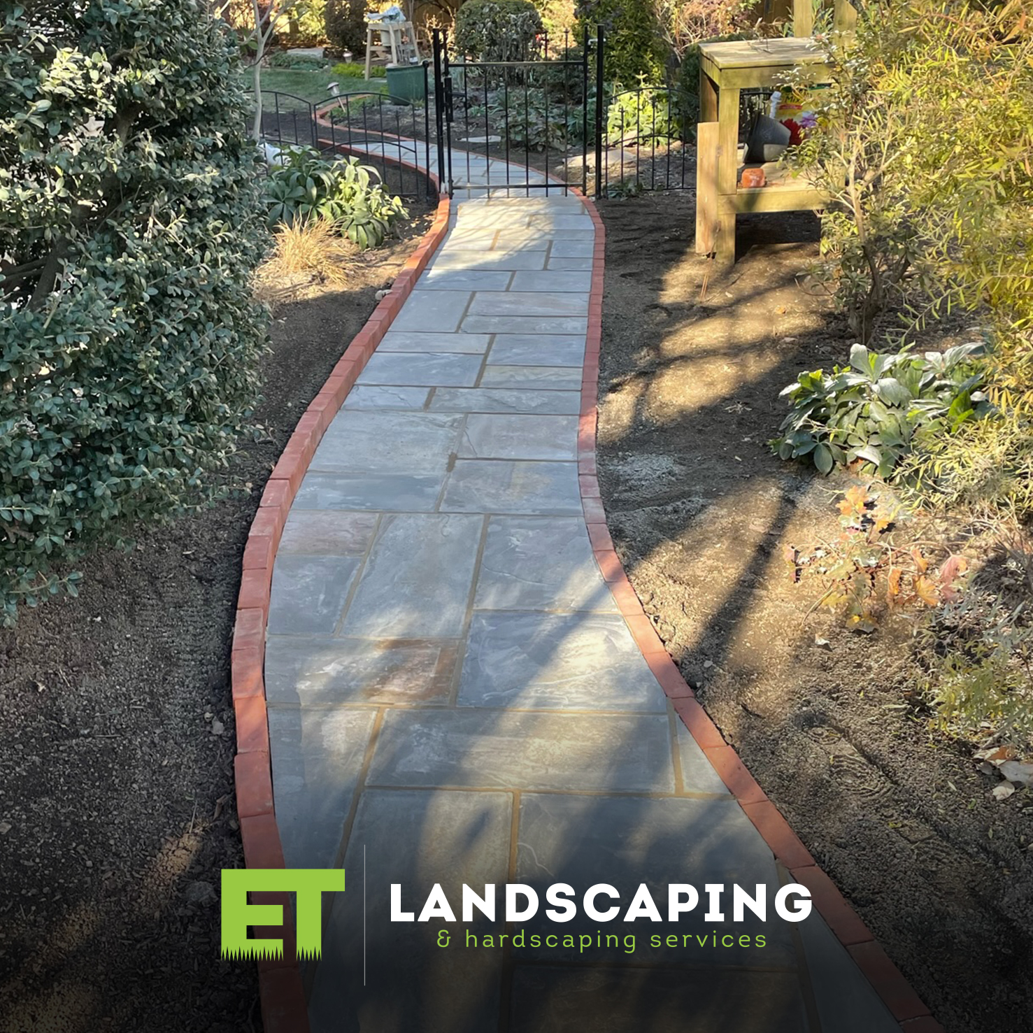 ET Landscaping Project: Flagstone Patio with Moss in Delaware County, PA