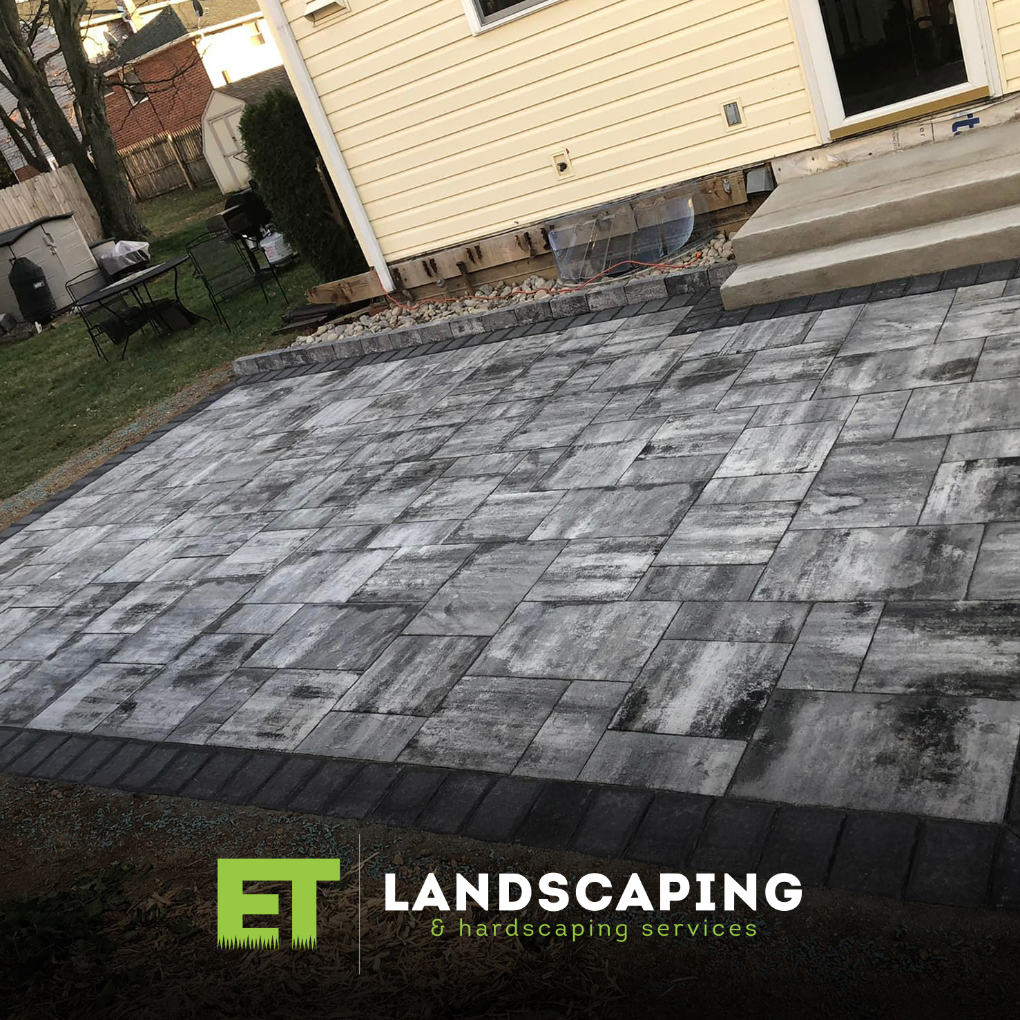ET Landscaping Project: Spacious Stone Patio in Delaware County, PA